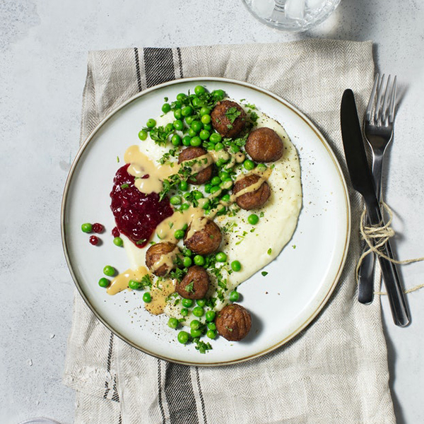 Meatballs With Mashed Potatoes Green Peas Cream Sauce And Lingonberry Jam