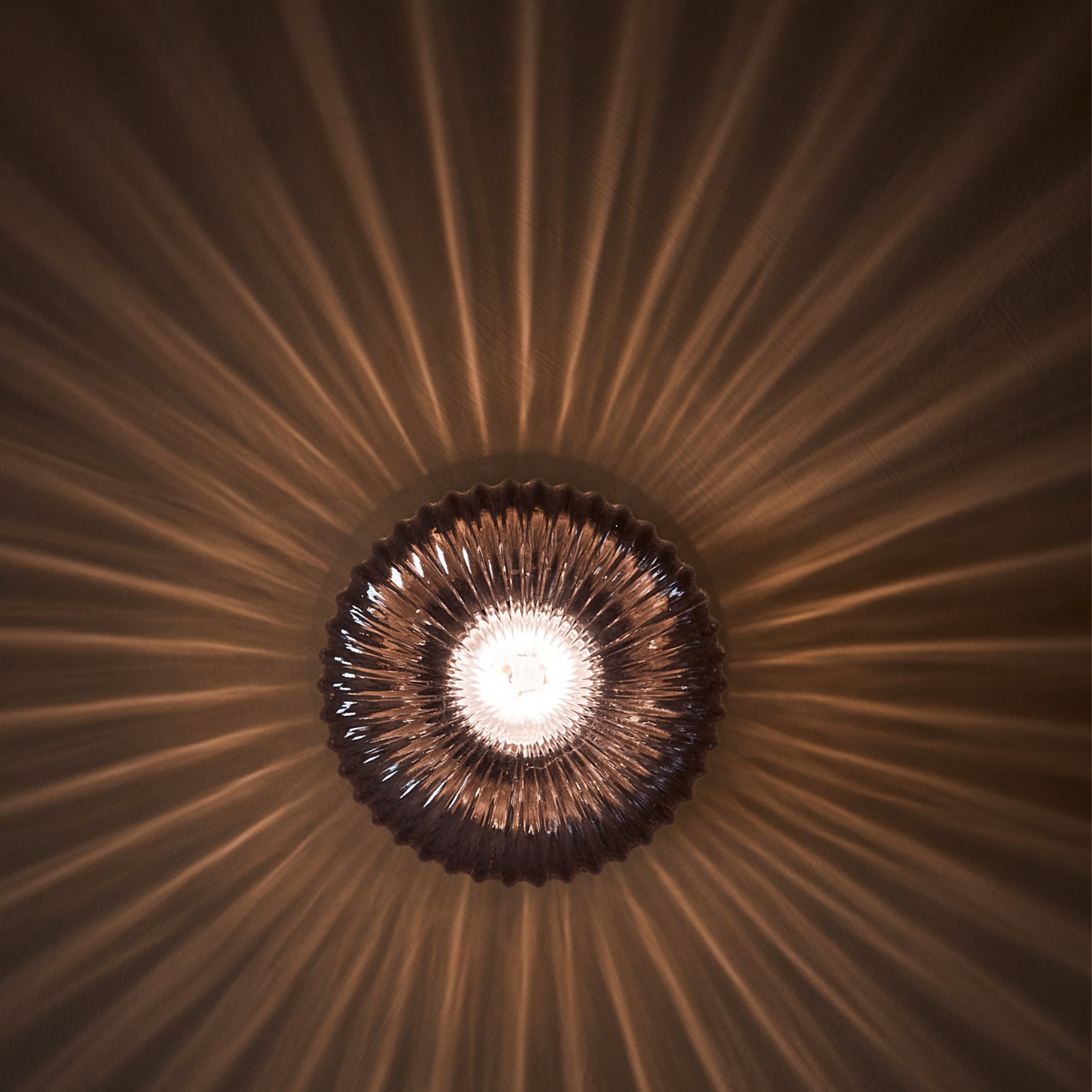 sun shaped wall light